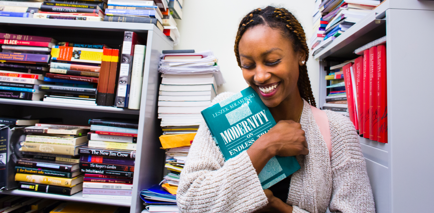 Woman hugging a book